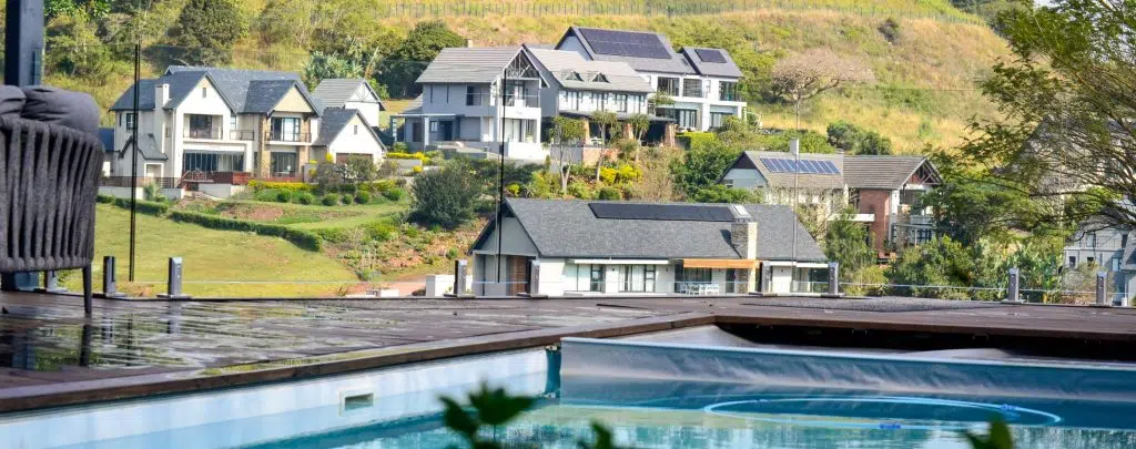 designer pool covers A pool with a hillside view.