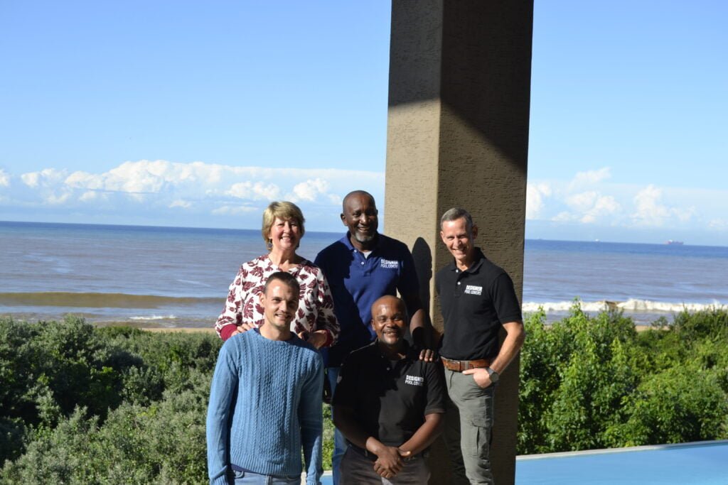 designer pool covers A group of people posing for a photo with stunning designer pool covers in Durban.