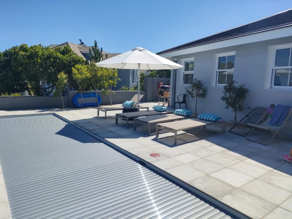 Pool Covers Expands Operations to Northwest, Introducing New Leadership 4 designer pool covers A patio with chairs and umbrellas.
